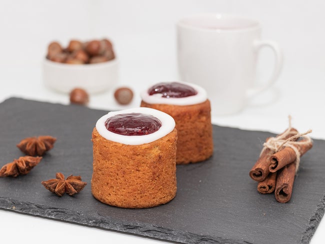 Runeberg Cakes (Runebergin Torttu) - traditional Finnish homemade pastry on a slate board, close-up. Runeberg day.